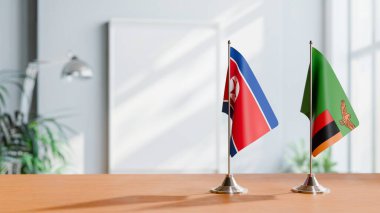 Masanın üzerinde Kore 'nin Kuzey ve ZAMBİA' nın bayrağı