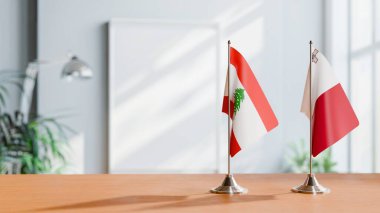 FLAGS OF LEBANON AND MALTA ON TABLE clipart