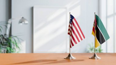 FLAGS OF LIBERIA AND MOZAMBIQUE ON TABLE clipart