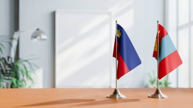 Masanın üzerinde LIECHTENSTEIN VE MoğolYA BALILARI