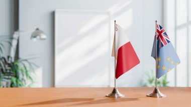 FLAGS OF MALTA AND TUVALU ON TABLE clipart