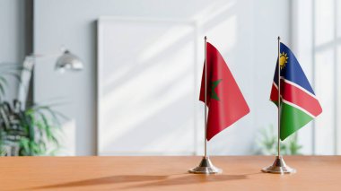 FLAGS OF MOROCCO AND NAMIBIA ON TABLE clipart