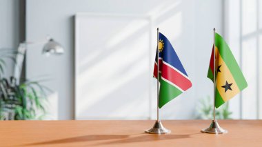 FLAGS OF NAMIBIA AND SAO TOME ON TABLE clipart