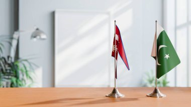 FLAGS OF NEPAL AND PAKISTAN ON TABLE clipart