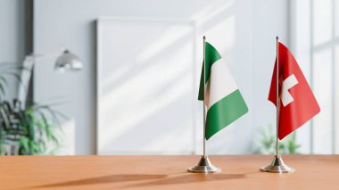 Sehpanın üzerinde Nijerya ve Şahidin Bayrakları