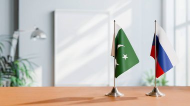 FLAGS OF PAKISTAN AND RUSSIA ON TABLE clipart