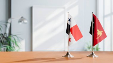 FLAGS OF PANAMA AND PAPUA NEW GUINEA ON TABLE