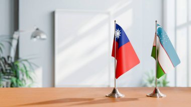 FLAGS OF TAIWAN AND UZBEKISTAN ON TABLE clipart