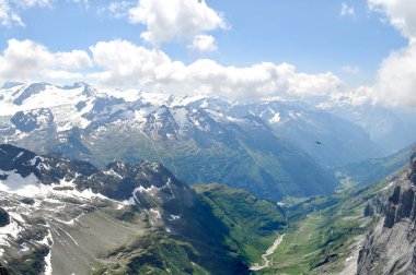 Climbing Mount Titlis in Engelberg, Switzerland, photo taken from the peak at Obwalden, with height around 3300 meters above sea level, seeing all breathtaking central Swiss Alps and highlands. clipart