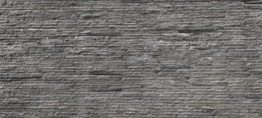 Striped cut andesite stone wall cladding stacked on one another. Andesite stone or lavastone is a good choice for outdoor architectural wall finishing, in grey color. clipart