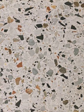 Renkli terrazzo granit döşeme dokusu. Terrazzo, çağdaş kenar ve şık iç mekanlarda duvar ya da zemin kaplaması olarak giderek daha çok kullanılıyor..