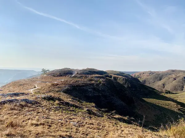 stock image Breathtaking landscape view of highland valleys at Warinding Hill, Sumba, Lesser Sunda Island, Indonesia. A naturally made highland savanna in the tropics. Famous for tourist and getting popular.