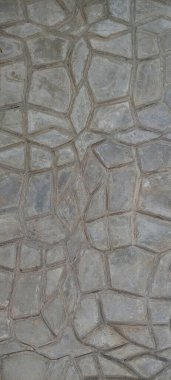 Molded texturized and patterned cement screed floor in custom and abstract geometrical patterns as raw concrete background texture. clipart