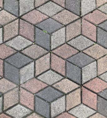 3 boyutlu geometrik küp ya da altıgen desenli kusursuz taş kaldırım dokusu. Koyu gri, pembe ve gri renkli. Asfaltın dokusu. Peyzaj taşı kaldırımı. İnsan Yok.