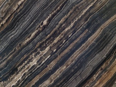 Kara Orman İtalyan mermer dokusu farklı taneler, desenler ve damarlarla. Bu tip mermerler savurgan görünüşüyle ünlüdür ve tahılların siyah gölgeleri bu zarafeti verir..