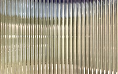 Flütlü cam dokusu, veya çizgili cam, arkasında ışıkların kırılması. Flüt flüt camları iç kısımlarda estetik olarak güzeldir ve kapı ve bölme işlemleri için kullanılır. Kusursuz flütlü cam panel.