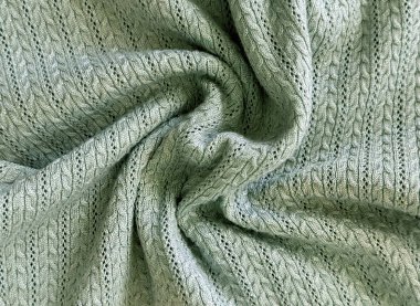 Kıvrımlı yeşil bir teal tosca döşeme kumaşı. Çiçek yaprakları ve sembol deseninde pamuk ve yünden yapılmış. Örgü konsepti, kıyafet için uygun. Kusursuz arkaplan kumaş dokusu.