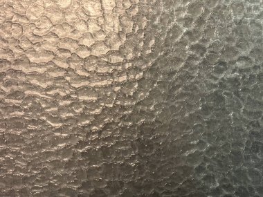 Dalgalanmış cam dokusunun detaylı dokusunu kapat. Ayrıca aquatex ya da sprey cam olarak da adlandırılır, kusursuz arkaplan dokusu