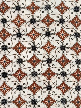 Kahve çekirdeği deseni. Elmas çiçekli. Geleneksel Endonezya kumaşı ya da Batik deseni. Eğri çiçekli elmas deseni tekrarlandı. Duvar örtüsü ya da kumaş. Kusursuz doku
