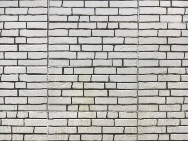 White brickwall texture on an exposed wall with cement and natural contour. clipart