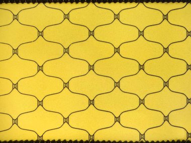 Rastgele elips ve oval yinelenen sarı arka planlı deseni kapat. Fenerin şeklini andıran baskılı kumaş. Kusursuz arkaplan dokusu.