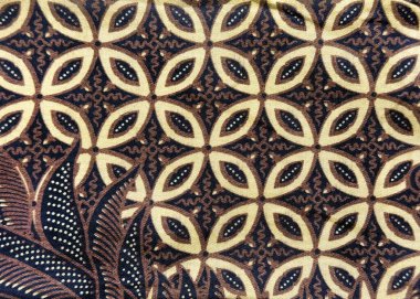 Geleneksel kahve çekirdeği şeklini ve çiçek desenini kapatın. Beyaz, kahverengi ve siyah renkte. Endonezya 'dan geleneksel Batik kumaşı. Kumaş ve duvar kağıdı için. Kusursuz arkaplan dokusu.