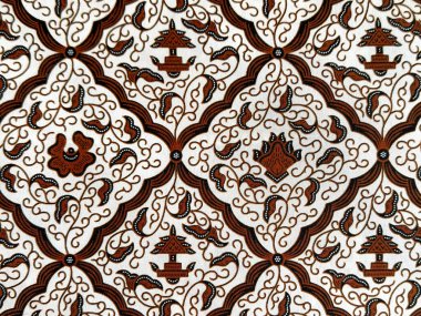 Geleneksel soyut süs, girdap ve elmas desenli etnik kumaş. Klasik etnik boyalı kumaş. Kusursuz arkaplan dokusu. Endonezya batik illüstrasyonu.