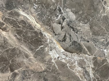 Rastgele beyaz damarlı doğal kahverengi mermer. Şatafatlı, nadir bulunan, gri mermer aksanlı imparator tipi. Doğal taş, mineral. Kusursuz arkaplan dokusu.