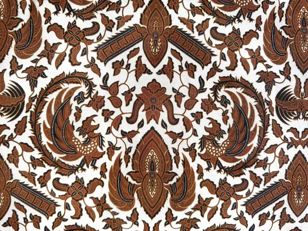 Geleneksel çiçek, yaprak, girdap ve süs desenli etnik kumaş. Klasik etnik boyalı kumaş. Kusursuz arkaplan dokusu. Kahverengi ve beyaz renk.