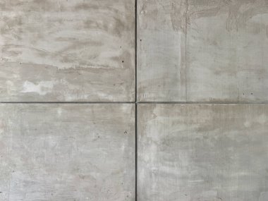 Dikdörtgen kiremitlerle dekoratif gri beton duvarı kapatın. Beton duvar çoğunlukla endüstriyel ve ham madde yapımında kullanılır. Kusursuz arkaplan dokusu.