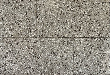 Renkli gri terrazzo granit döşeme dokusu. Terrazzo, çağdaş kenar ve şık iç mekanlarda duvar ya da zemin kaplaması olarak kullanılmaya başlandı. Gri kuvars taşı dikişsiz arkaplan dokusu. 