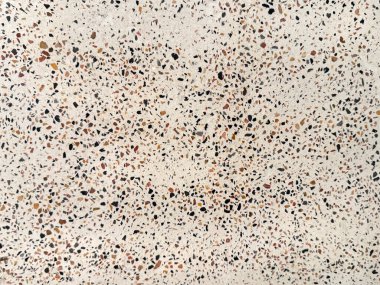 Renkli küçük mezar desenli beyaz terrazzo granit kiremitleri kapatın. Terrazzo, çağdaş kenar ve şık iç mekanlarda duvar ya da zemin kaplaması olarak giderek daha çok kullanılıyor..