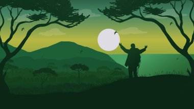 Doğanın güzelliğinden keyif alan genç bir adam Tepenin tepesinden - Güzel 2B manzara silueti