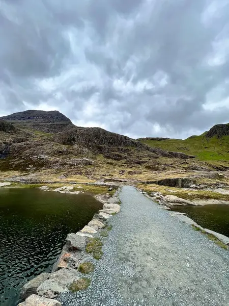 stock image Path over a lake at the bottom of Snowdon, Yr Wyddfa, Wales.