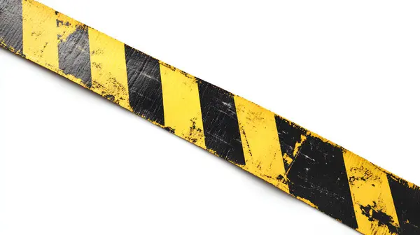 stock image Distressed yellow and black barricade tape against white background