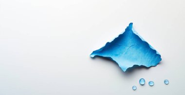 Beyaz arkaplanda mavi su sıçraması var.