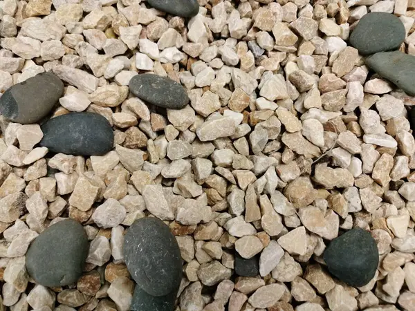 Pürüzsüz nehir taşları, arka plan, peyzaj ya da Zen bahçe tasarımı için mükemmel, büyük çakıl taşları ve keskin kenarlı çakıllar Paving, çakıl taşları için.