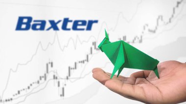 New York - ABD, 25 Aralık 2024: Baxter Stock Uptrend with Selective Focus on green origami Bull, sembolize edilen Baxter Bullish pazar trendi. Finansal Büyüme kavramını yakalar