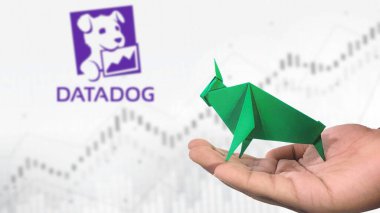 New York - ABD, 25 Aralık 2024: DATADOG Stock Uptrend with Selective Focus on green origami Bull, sembolize edilen DATADOG Bullish market trendi. Finansal Büyüme kavramını yakalar