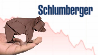 New York - ABD, 13 Ocak 2025: SCHLUMBERER hisse senedi düşüşü kahverengi origami ayısı üzerine Seçici Odaklanma, SCHLUMBERER 'in bir hamallık piyasa duyarlılığını tasvir ediyor. Finansal çöküş kavramını yakalıyor