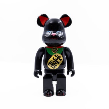 A unique fusion of Japanese and Western cultures, this black Bearbrick figurine is designed in the style of a traditional Maneki-neko, or lucky cat. The figure features a glossy black finish and gold accents, making it a stylish addition to any colle clipart