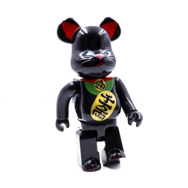 A unique fusion of Japanese and Western cultures, this black Bearbrick figurine is designed in the style of a traditional Maneki-neko, or lucky cat. The figure features a glossy black finish and gold accents, making it a stylish addition to any colle clipart