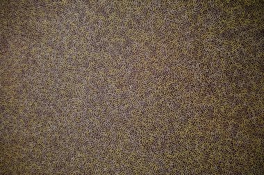 Tekrarlayan nokta deseninin, sessiz sarı ve gri tonlarda yakın çekimi. Minimalist, soyut tasarım, modern arka planlar veya dekoratif kavramlar için ideal büyüleyici bir yapı yaratır.
