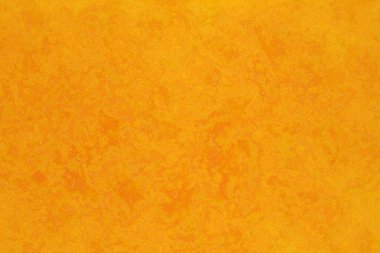A vibrant, textured yellow background with subtle variations in tone creating a rustic or aged appearance.