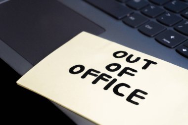 A close-up of a yellow sticky note with the words 