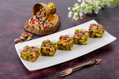 Discover the rich flavors of traditional oriental sweets made with crunchy pistachios. Perfect for dessert lovers, these authentic treats blend nutty and sweet tastes for a delightful experience. clipart