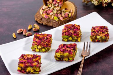 Discover the rich flavors of traditional oriental sweets made with crunchy pistachios. Perfect for dessert lovers, these authentic treats blend nutty and sweet tastes for a delightful experience. clipart