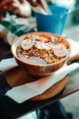 Bananas and strawberries in acai bowl at restaurant in Porto, Portugal clipart