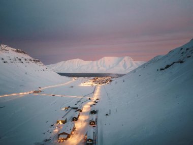 Aerial shot of Longyearbyen, Svalbard at sunset in the arctic winter clipart