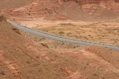 Asphalt road through the desert clipart